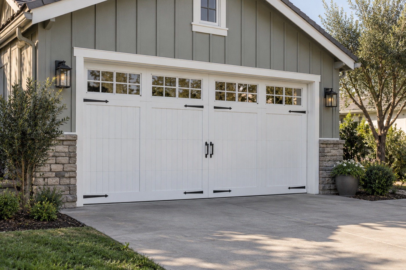 White carriage-style door on a gray board-and-batten house